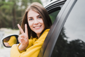 woman-facing-camera-doing-peace-sign